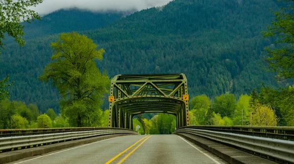 Old iron bridge in the background of mountains, Washington state, USA