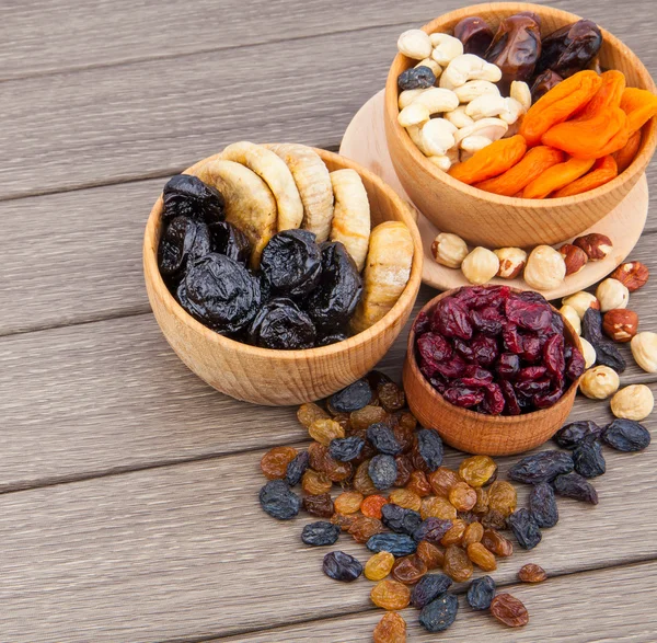 Dried fruits in wooden bowl — Stock Photo, Image