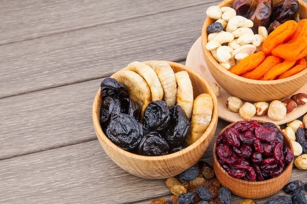 Dried fruits in wooden bowl — Stock Photo, Image