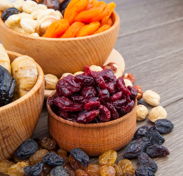 Dried fruits in wooden bowl — Stock Photo, Image