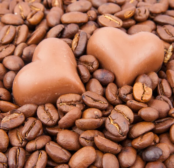 Heart candy on coffee beans — Stock Photo, Image