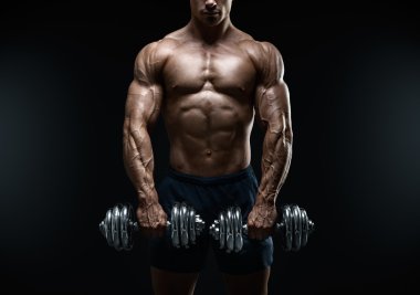 Strong and power bodybuilder doing exercises with dumbbell clipart