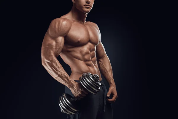Strong and power bodybuilder doing exercises with dumbbell — Stock Photo, Image