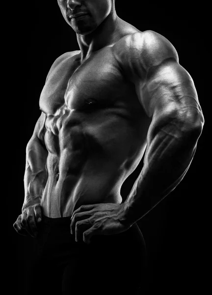 Muscular and fit young bodybuilder fitness male model posing. — Stock Photo, Image