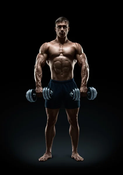 Strong and power bodybuilder doing exercises with dumbbell — Stock Photo, Image