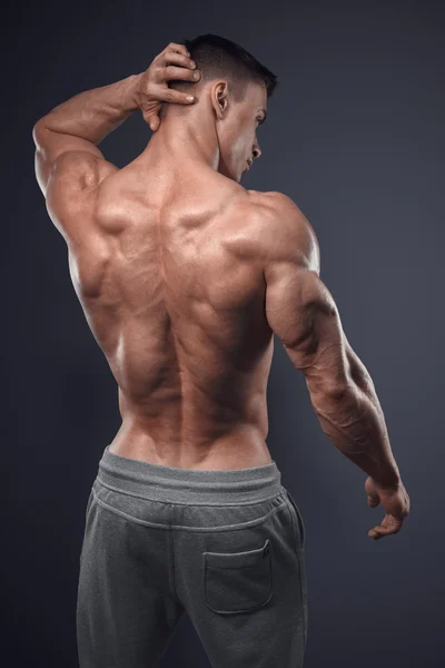 Handsome power athletic man turned back — Stock Image Handsome power athletic man turned back Royalty Free Stock Photos