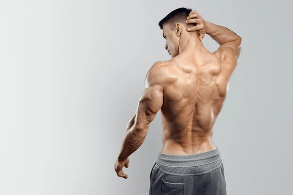 Handsome power athletic man turned back — Stock Image Handsome power athletic man turned back Stock Photo