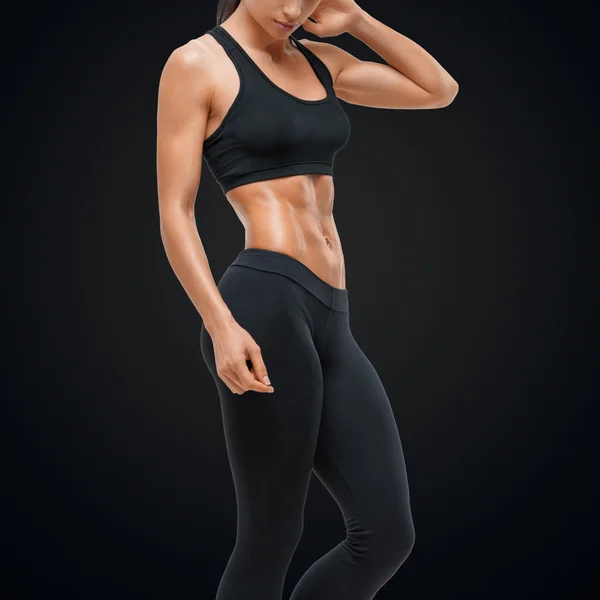 Fitness sporty woman showing her well trained body — Stock Photo, Image