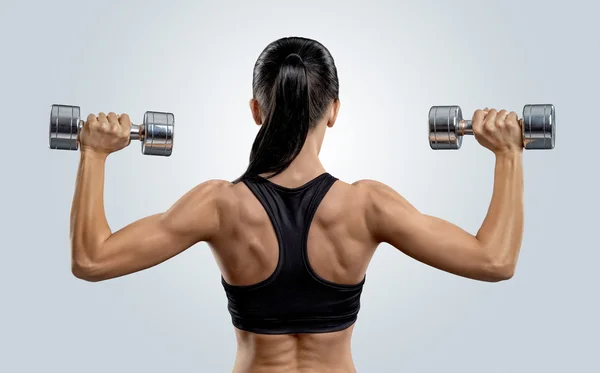 Fitness nő képzést izmok, a hát, a súlyzó — Stock Fotó