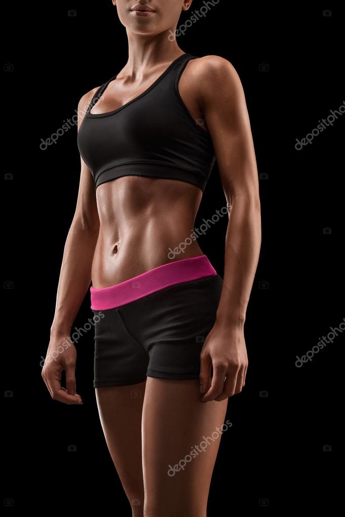 Free Photo  Cropped close up body of fit woman wearing shorts and sport  top showing slim beautiful stomach and abs