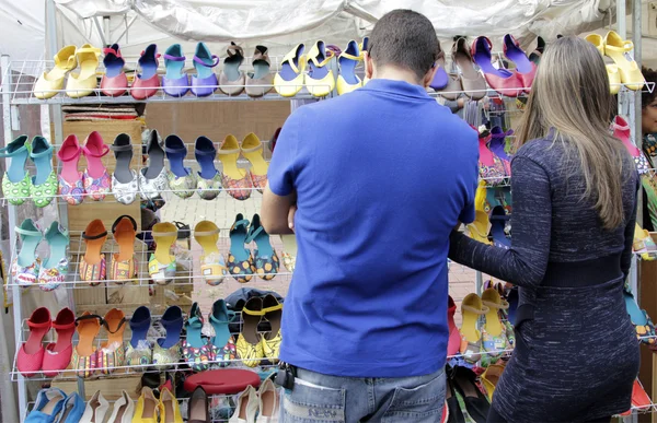 Couple choose products in a street market fair — Stock Photo, Image