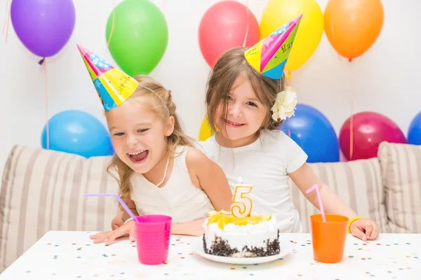 Two little girls at a birthday party — Stock Photo, Image