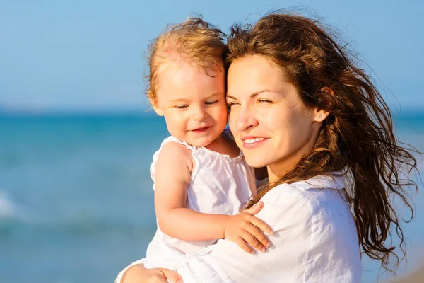 Mother and daughter on the beach Royalty Free Stock Images