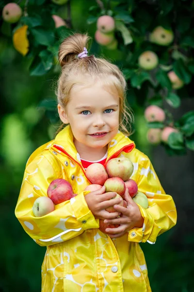 Little girl in the apple garden — Stock Photo, Image