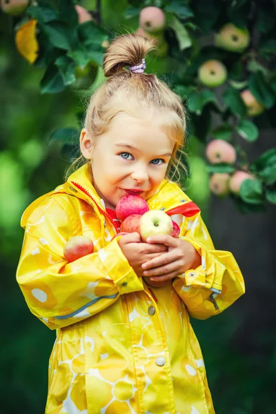 Little girl in the apple garden — Stock Photo, Image