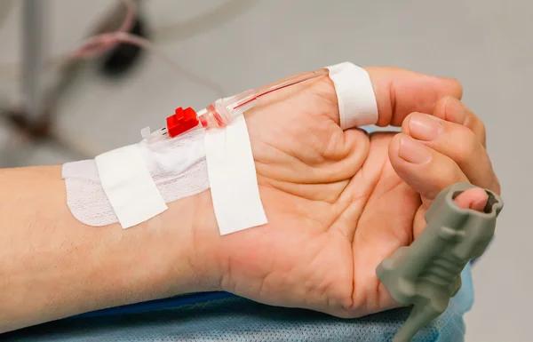 Hand with catheter and oxymeter — Stock Photo, Image