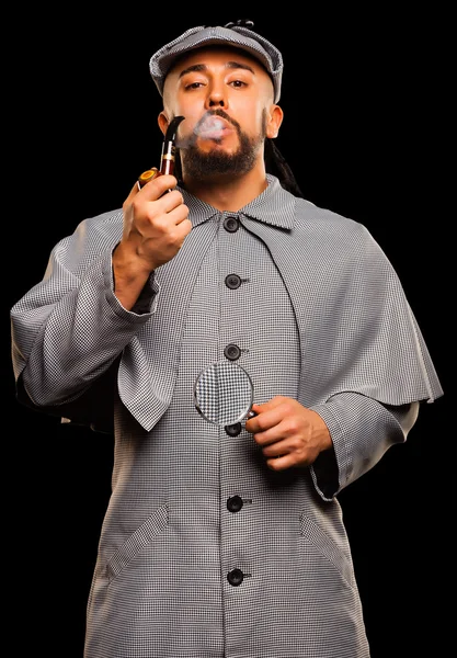 Sherlock Holmes with pipe and magnifying glass — Stock Photo, Image