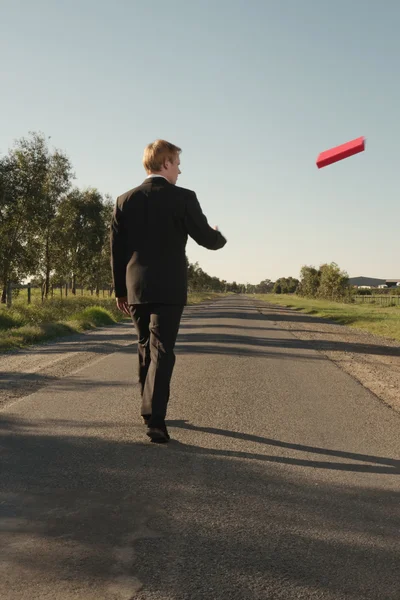 Businessman throws red file — Stock Photo, Image