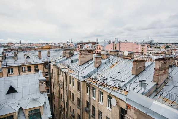 Iron roofs of houses in old city. Top view of winter St. Petersburg.