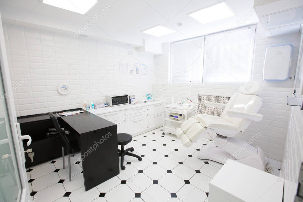 Interior of office of podiatrist, master of medical pedicure. Beauty salon design in light colors.