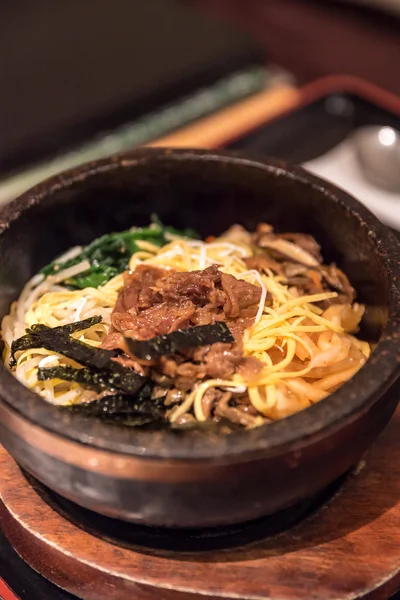 Bibimbap in a heated stone bowl — Stock Photo, Image