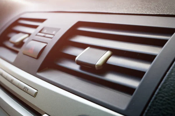 Close-up of the fan or air conditioner grilles in the car interior. Airing the car — Stock Image Close Fan Air Conditioner Grilles Car Interior Airing Car Royalty Free Stock Images