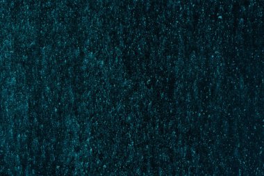 Tasarım için karanlık ve soyut bir arkaplan. Boş turkuaz üniforma yüzeyi. Reklam ya da reklam için boş