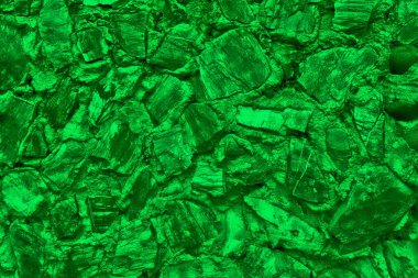 Büyük taştan yapılmış soyut bir arkaplan. Yeşil renkli boş taş yüzey.