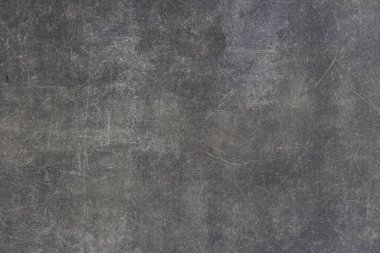 Çizikler ve yaşlanma etkisiyle boş gri bir yüzey. Bir mat dokusu ile bilgi yerleştirmek için tarafsız arkaplan.