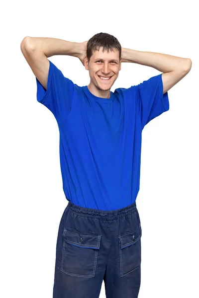 İş eşyası reklamı. Rahat ve pozitif bir adamın portresi. İş pantolonlu ve mavi tişörtlü.. — Stok fotoğraf