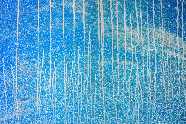 Abstrakter blauer Hintergrund. Leere Fläche. Spuren oder Spritzer aus Wasser. — Stockfoto