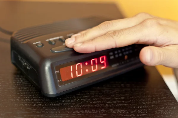 Snoozing the morning alarm — Stock Photo, Image