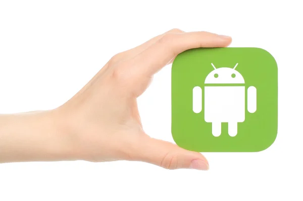 Χέρι κρατά Android λογότυπο που βλέπετε σε έντυπη μορφή σε άσπρο φόντο — Φωτογραφία Αρχείου