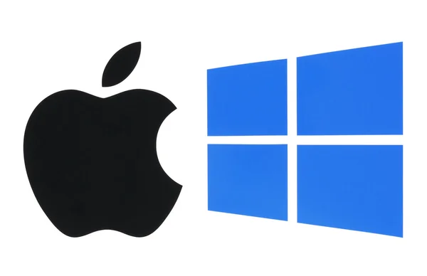 Logo sistem operasi populer yang dicetak di atas kertas: Apple ios dan Windows — Stok Foto