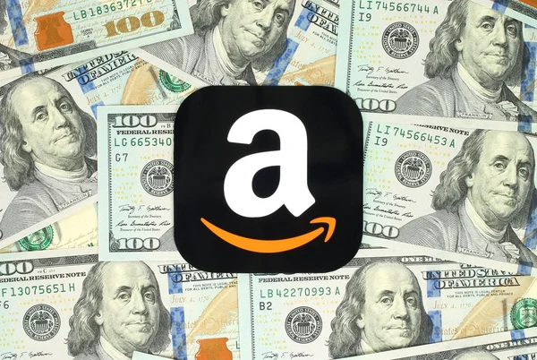 Amazon icon printed on paper and placed on money background — Stock Photo, Image