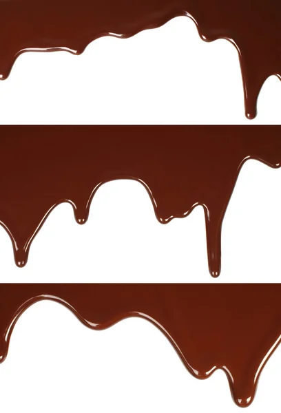 Smält choklad droppande set på vit bakgrund — Stockfoto
