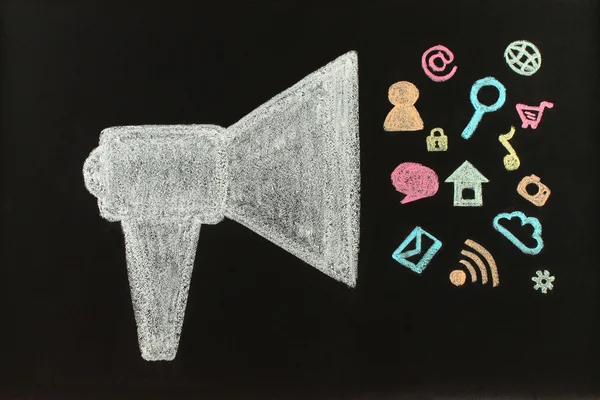 Chalk megaphone with flying icons drawn — Stock Photo, Image