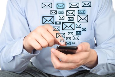 Businessman uses smart phone with virtual envelopes