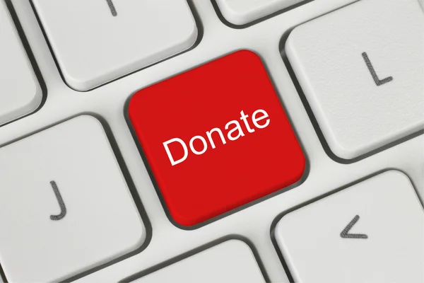 Red donate button on the keyboard — Stock Photo, Image