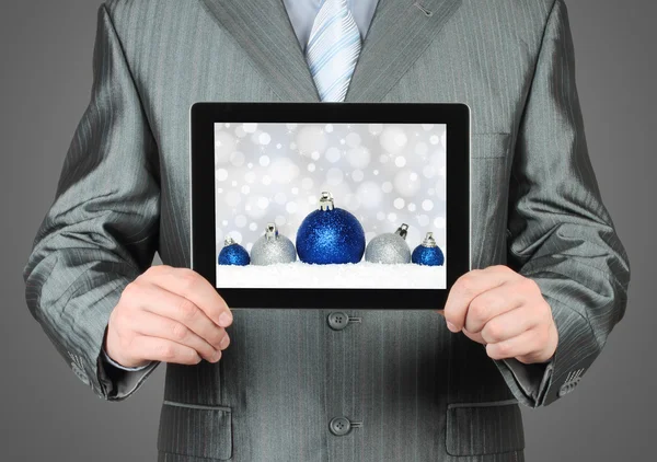 Man holds tablet PC with Christmas composition — Stock Photo, Image