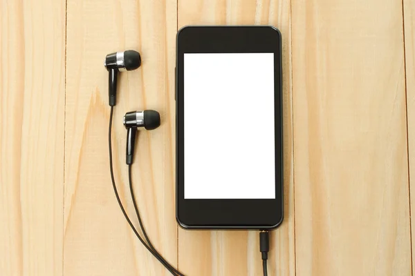 Smart phone with headphones — Stock Photo, Image