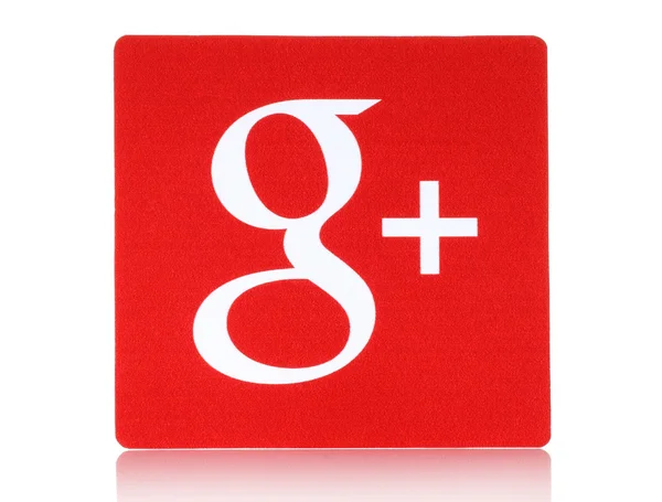 Google plus logotype dicetak di atas kertas dan ditempatkan di latar belakang putih — Stok Foto