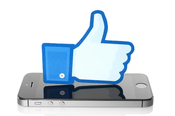 Facebook thumbs up sign on iPhone — Stock Photo, Image