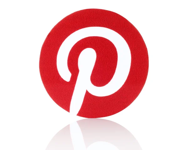 Pinterest logotype printed on paper. Pinterest is photo sharing website — Stock Photo, Image