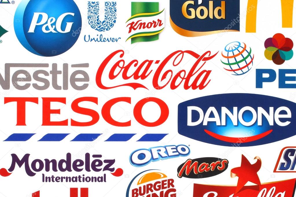 KIEV, UKRAINE - MAY 07, 2015:Collection of popular food logos companies printed on paper:Coca-Cola, Pepsico, Nestle, Tesco and other