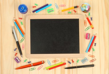 Chalkboard with school office supplies