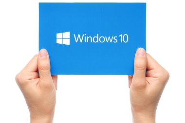 Hand holds Windows 10 logotype printed on paper