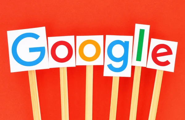 New Google logotype printed on paper, cut and pasted on wooden sticks