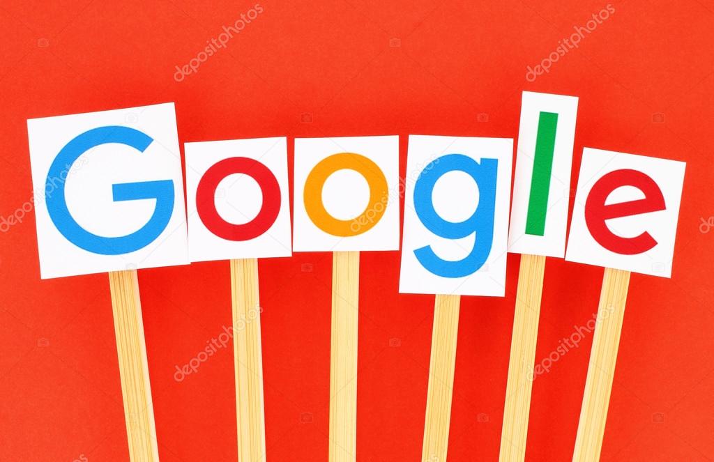 KIEV, UKRAINE - SEPTEMBER 02, 2015:New Google logotype printed on paper, cut and pasted on wooden sticks.Google is USA multinational corporation specializing in Internet-related services.