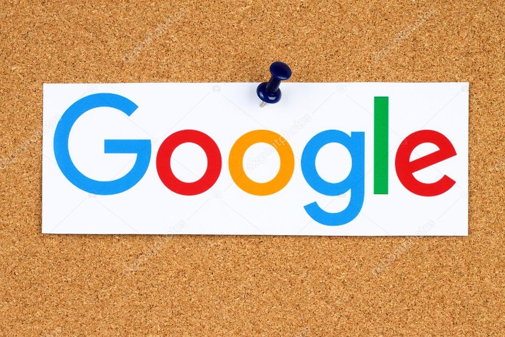 KIEV, UKRAINE - SEPTEMBER 02, 2015:New Google logotype printed on paper, cut and pinned on cork bulletin board.Google is USA multinational corporation specializing in Internet-related services.